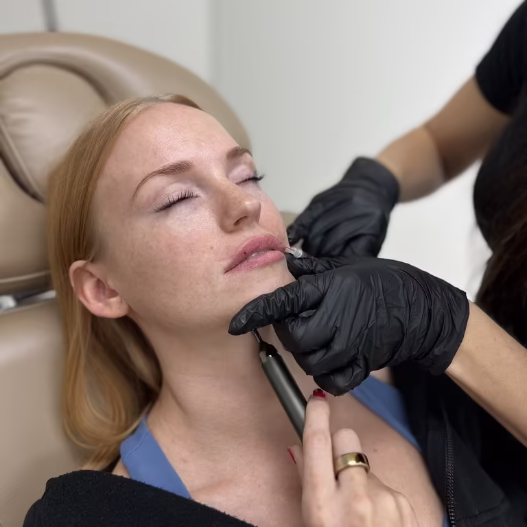 Expert injector performing a precise lip filler procedure in Scottsdale